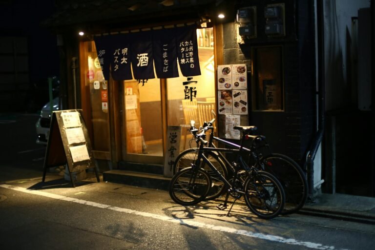 Bicycles parked outside a traditional Japanese restaurant in Fukuoka city, Japan.